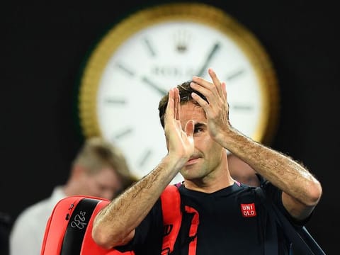 Roger Federer applauds after losing to Novak Djokovic in the Australian Open semi-finals, the last competitive match he has played this year.