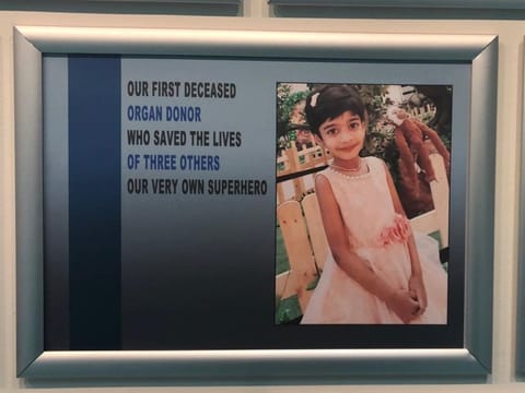 The photo of young kidney donor Dervisiri Tavva on the wall of fame at Shaikh Khalifa Medical City
