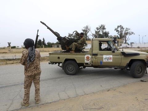 In this May 21, 2019 file photo, Tripoli government forces clash with forces led by Field Marshal Khalifa Haftar, south of Tripoli. Two Libyan militia commanders and a Syrian war monitor group say Turkey is deploying Syrian extremists to fight in Libya's civil war.