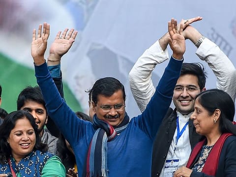 Aam Aadmi Party chief Arvind Kejriwal (C) gestures towards his supporters at the party headquarters in New Delhi (File)