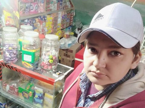 Farheen Ishtiaq works at a corner shop in Lahore to make ends meet
