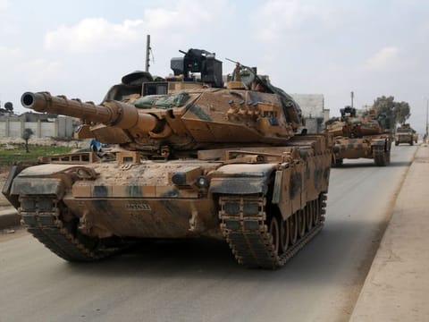 A convoy of Turkish M-60T tanks patrols in the town of Atareb in the rebel-held western countryside of Syria's Aleppo province on February 19, 2020.
Turkey and Russia were engaged in a fresh war of words today after President Recep Tayyip Erdogan threatened an "imminent" operation in Syria to end the regime's brutal assault on the last rebel enclave. It came as Syrian aid workers issued an urgent call for a ceasefire and international help for nearly a million people fleeing the regime onslaught in the country's northwestern Idlib province -- the biggest wave of displaced civilians in the nine-year conflict. / AFP / Aref TAMMAWI