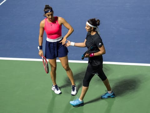 Sania Mirza (right) with her partner Caroline Garcia during the Dubai Duty Free Championships in February.