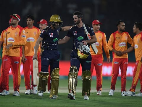 File photo: Quetta Gladiators' Ben Cutting (front R) and Abdul Nasir (front L) walk back the pavilion after winning the Pakistan Super League (PSL) Twenty20 cricket match between Quetta Gladiators and Islamabad United at The National Cricket Stadium in Karachi on February 20, 2020.