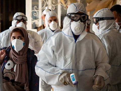 A medical team checks on travellers at the Shalamjah border crossing upon their return from Iran. The UAE health ministry confirmed an Iranian couple have been diagnosed with Covid 19 in the UAE taking the total number of cases in the country to 13.