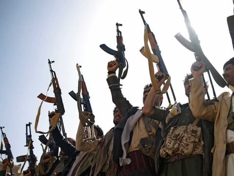 Al Houthi fighters chant slogans during a gathering to mobilise more fighters for the Iranian-backed militia, in Sanaa, Yemen, on February 20, 2020.