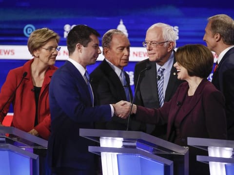 From left, Democratic presidential candidates, Sen. Elizabeth Warren, former South Bend Mayor Pete Buttigieg, former New York City Mayor Mike Bloomberg, Sen. Bernie Sanders, Sen. Amy Klobuchar, and businessman Tom Steyer, greet one another on stage at the end of the Democratic presidential primary debate at the Gaillard Center on Tuesday in Charleston, South Carolina, co-hosted by CBS News and the Congressional Black Caucus Institute.
