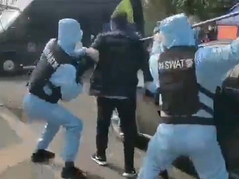 Chinese SWAT team practice taking down a coronavirus-infected man