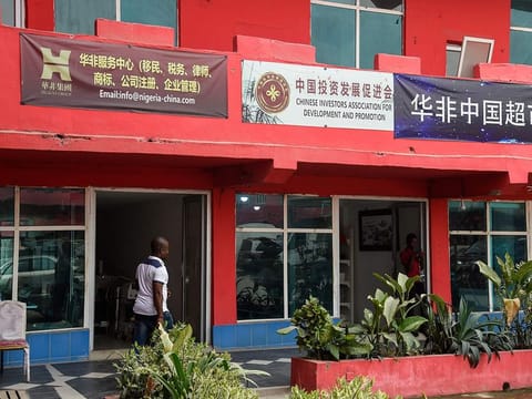 A man walks past empty shops in the deserted China Commercial City shopping centre, popularly called "China Town", in Ojota in Lagos, as people fear of contracting the COVID-19, the novel coronavirus on February 27, 2020.