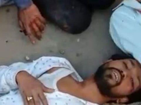 Man beaten within an inch of his life during the Delhi riots.