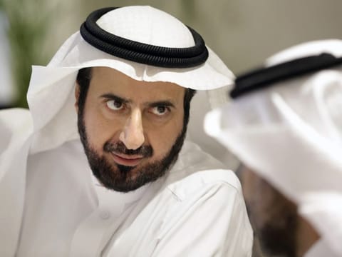 Saudi health minister Tawfiq Al Rabiah, talks to a health official as he discuss the latest situation on coronavirus at the Saudi Food and Drug Authority in Riyadh February 27.