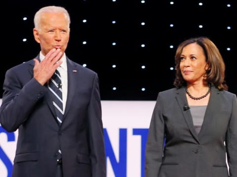 Former Vice-President Joe Biden and US Senator Kamala Harris take the stage on the second night of the second 2020 Democratic U.S. presidential debate in Detroit on July 31, 2019. Harris has endorsed Biden as the Democratic presidential candidate.