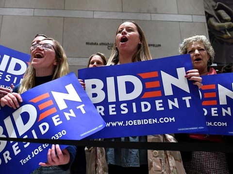 Supporters of Democratic presidential hopeful former US vice-president Joe Biden cheers as he speaks at the National Constitution Centre in Philadelphia, Pennsylvania, on March 10, 2020.