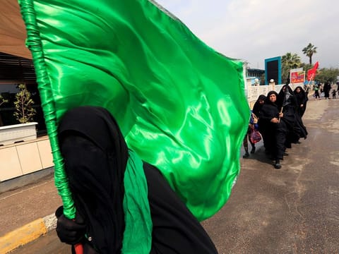 Shi'ite pilgrims make their way to Kadhimiya to mark the death of Imam Moussa al-Kadhim during a curfew imposed to prevent the spread of coronavirus disease (COVID-19), in Baghdad