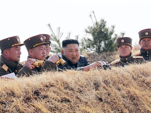 North Korean leader Kim Jong Un (C) inspecting an artillery fire competition between large combined units of the Korean People's Army (KPA) on the western front.