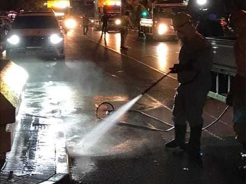Dubai Municipality staff sterilise the streets of the city in the early hours of Saturday.