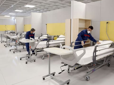 Iranian workers set up a makeshift hospital inside the Iran Mall, northwest of Tehran, on March 21.