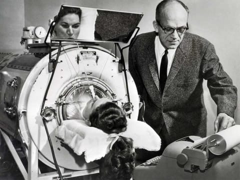 Polio was an ever-present threat for decades. Here, a victim assisted by an Emerson Respirator, better known as an iron lung.