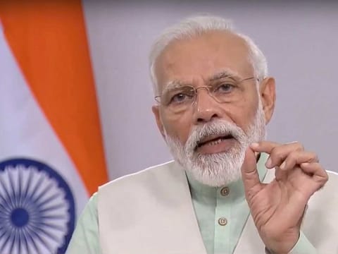 Prime Minister Narendra Modi addresses the nation on COVID-19 via a video message, in New Delhi, Friday, April 3, 2020. Modi urged people to switch off lights in their homes at 9pm for nine minutes on April 5 and light up lamps, candles, mobile flashlights to display the nation's collective spirit to defeat coronavirus.