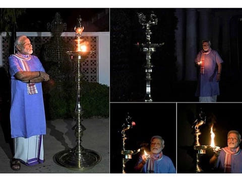Narendra Modi lighting the lamp