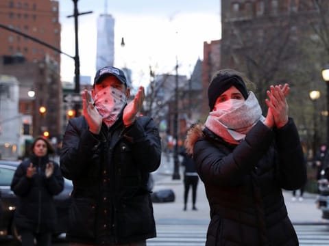 Members of the public applaud medical workers during the outbreak of the coronavirus disease in the Manhattan borough of New York City on April 10.