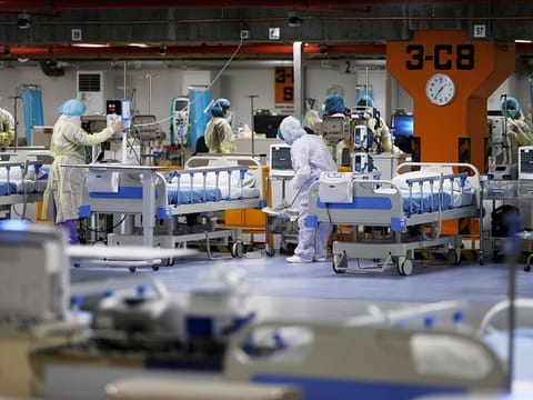 Doctors and nurses are seen doing their final check on the equipment in a makeshift ICU "Field Intensive Care Unit 1" set up by Bahrian authorities to treat the coronavirus disease (COVID-19) critical patients, at a car-park of Bahrain Defence Force Hospital in Riffa, Bahrain, April 14, 2020.