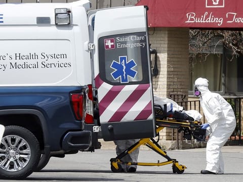 Healthcare officials load a patient into an ambulance at Andover Subacute and Rehab Center, during the coronavirus disease (COVID-19) outbreak, in Andover, New Jersey, US