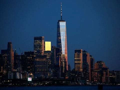 The One World Trade Center and lower Manhattan are seen during the sunset from Weehawken, New Jersey, during the outbreak of the coronavirus disease (COVID-19) in New York City, U.S. April 22, 2020.
