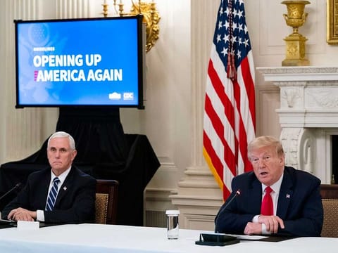 President Donald Trump and Vice-President Mike Pence participate in a roundtable with industry executives on the plan for Opening Up America Again, at the White House in Washington, Wednesday, April 29, 2020.