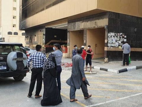 Residents outside the fire-hit Abbco Tower in Sharjah