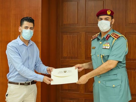 Mohammad Omar honoured by Colonel Sami Khamis Al Naqbi, Director General of Sharjah Civil Defence for saving the life of an 11-year-old girl in the Sharjah tower blaze