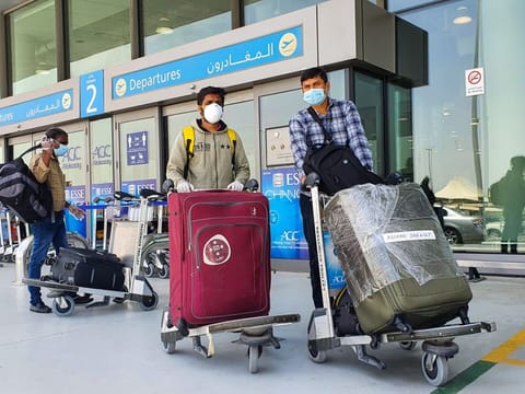 Passengers at Dubai International's Terminal-2 ahead of the first Air India Express repatriation flight to Kozhikode in Kerala.