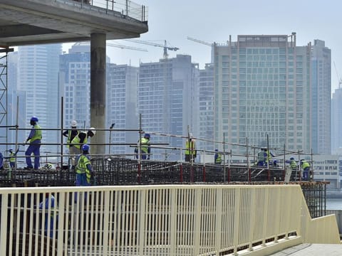 Construction workers hard at work during the afternoon Photo Clint Egbert/Gulf News