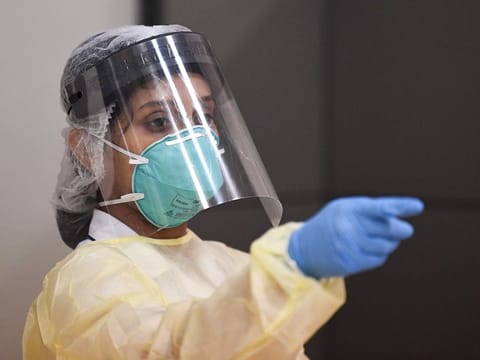 A member of a medical team at work at Dubai International Airport.