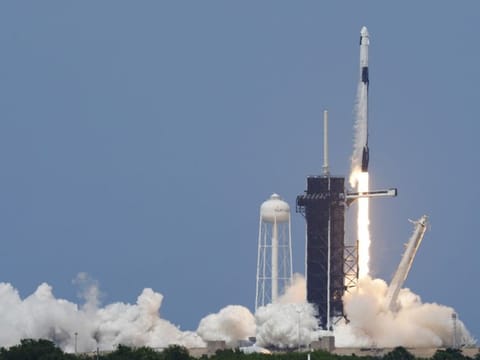A SpaceX Falcon 9, with NASA astronauts Doug Hurley and Bob Behnken in the Dragon crew capsule, lifts off from Pad 39-A at the Kennedy Space Center in Cape Canaveral, Fla., Saturday, May 30, 2020. For the first time in nearly a decade, astronauts blasted towards orbit aboard an American rocket from American soil, a first for a private company. (AP Photo/David J. Philip)