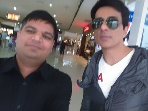 Sonu Sood seen here with a stranded Indian looking for repatriation