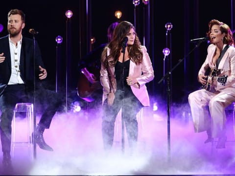 (FILES) In this file photo taken on November 13, 2019 (L-R) Charles Kelley and Hillary Scott of Lady Antebellum and Halsey perform onstage during the 53rd annual CMA Awards at the Bridgestone Arena in Nashville, Tennessee. The Grammy-winning country group formerly known as Lady Antebellum on June 11, 2020, announced their new name Lady A, with members saying they were "embarrassed" for not considering the band name's link to slavery. The term "antebellum" refers to a time period before a war, and is widely associated with the pro-slavery American South in the pre-Civil War years.
- -- IMAGE RESTRICTED TO EDITORIAL USE - STRICTLY NO COMMERCIAL USE --
/ AFP / GETTY IMAGES NORTH AMERICA / Terry Wyatt / -- IMAGE RESTRICTED TO EDITORIAL USE - STRICTLY NO COMMERCIAL USE --