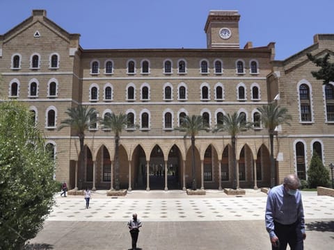 People walk on American University of Beirut's campus (AUB,) one of the oldest and most prestigious education institutions in the Middle East region, Monday, June. 22, 2020.