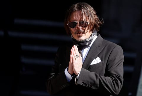 Actor Johnny Depp arrives at the High Court in London, Britain July 10.