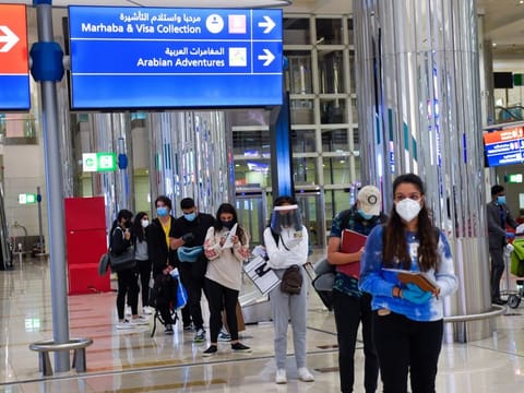 Passengers arrive at Terminal 3, Dubai International Airport.