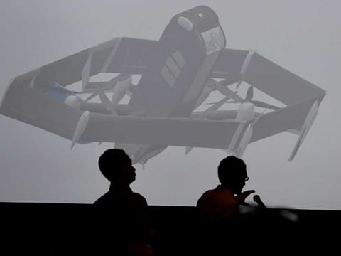 The new Amazon delivery drone is displayed on a screen during the Amazon Re:MARS conference on robotics and artificial intelligence in Las Vegas, Nevada.