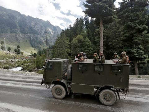 Indian army soldiers are seen atop a vehicle on a highway leading to Ladakh, at Gagangeer in Kashmir's Ganderbal district September 2, 2020.