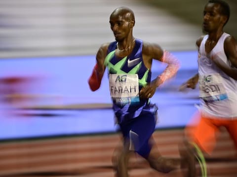 Britain's Mo Farah competes with Belgium's Bashir Abdi during the men's one hour event at The Diamond League AG Memorial Van Damme athletics meeting at The King Baudouin Stadium in Brussels
