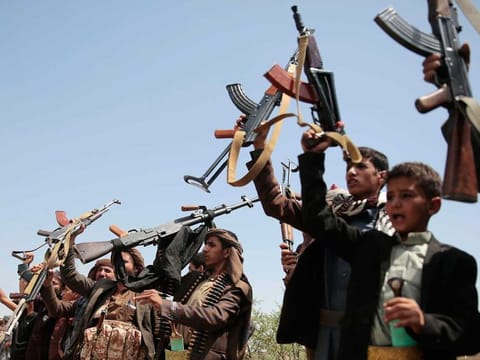Al Houthi rebels chant slogans during rally in Sanaa, Yemen, on August 22, 2020.
