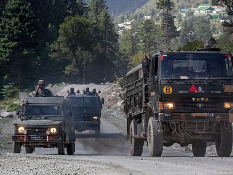 An Indian army convoy moves on the Srinagar- Ladakh highway at Gagangeer, northeast of Srinagar, Wednesday, Sept. 9, 2020. China and India have been engaged in a tense standoff in the cold-desert Ladakh region since May.