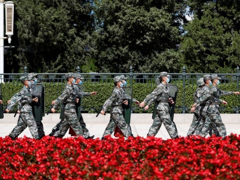 Soldiers of the People's Liberation Army (PLA) march outside the Great Hall of the People in Beijing, China September 8, 2020.