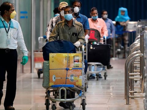 Indian citizens from Dubai arrive at Chennai airport.