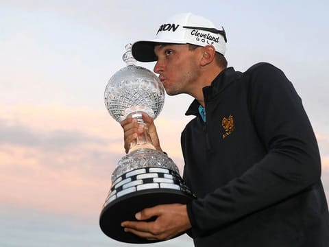 John Catlin celebrates with the trophy after winning the Dubai Duty Free Irish Open