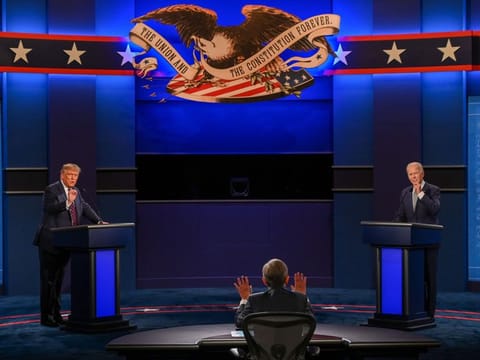 US President Donald Trump and Democratic Presidential candidate Joe Biden exchange arguments as moderator Chris Wallace (C) raises his hands to stop them during the first presidential debate at Cleveland, Ohio, on September 29, 2020