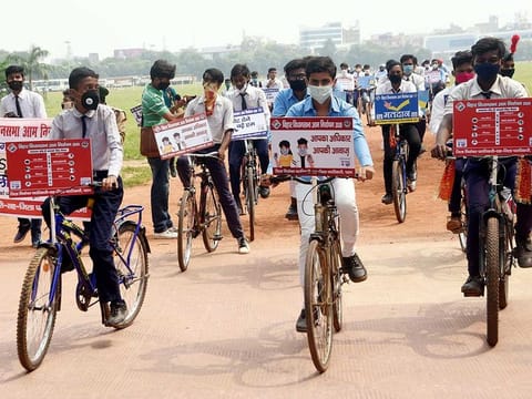 School students participate in a voter awareness cycle rally for the upcoming Bihar assembly elections, in Patna on Monday.